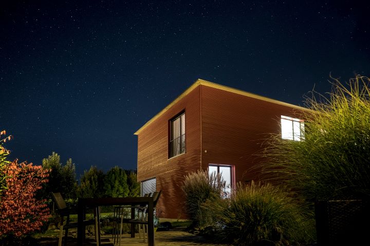 a house at night with the lights on